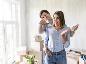 woman-surprised-by-partner-with-keys-their-new-home